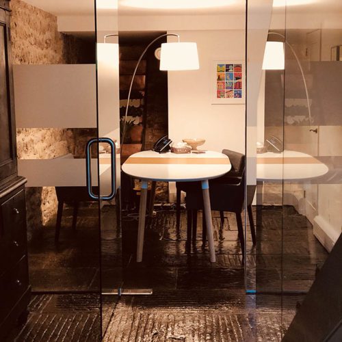 The inside of an office room with warm lighting.