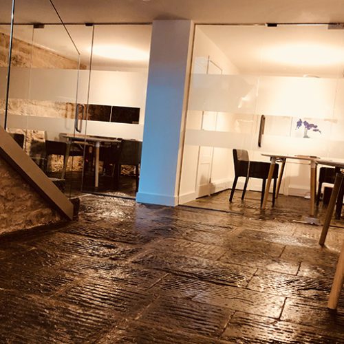 An office with stone flooring.