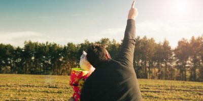 A dad and child outside enjoying nature