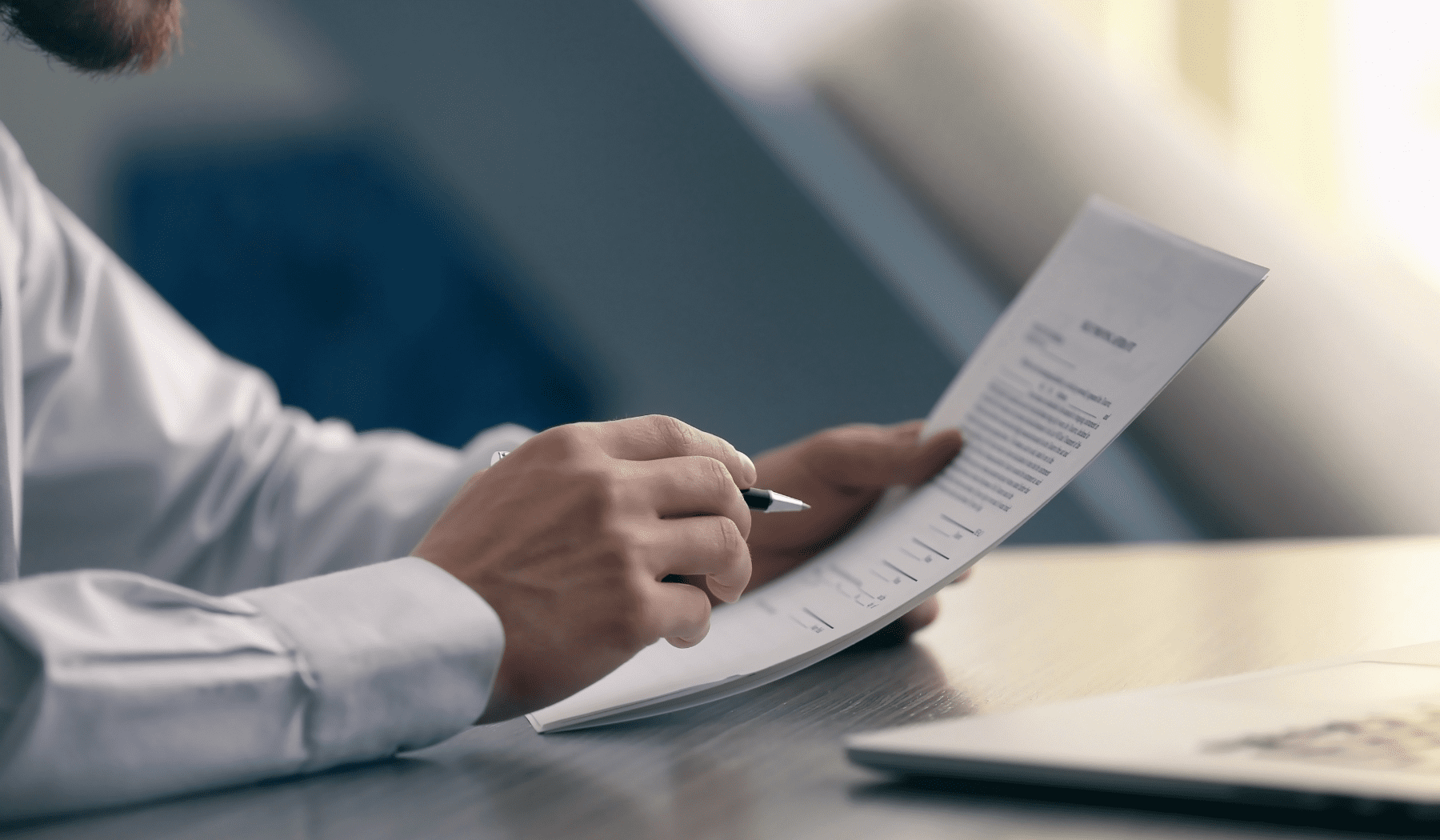 Someone reviewing financial document