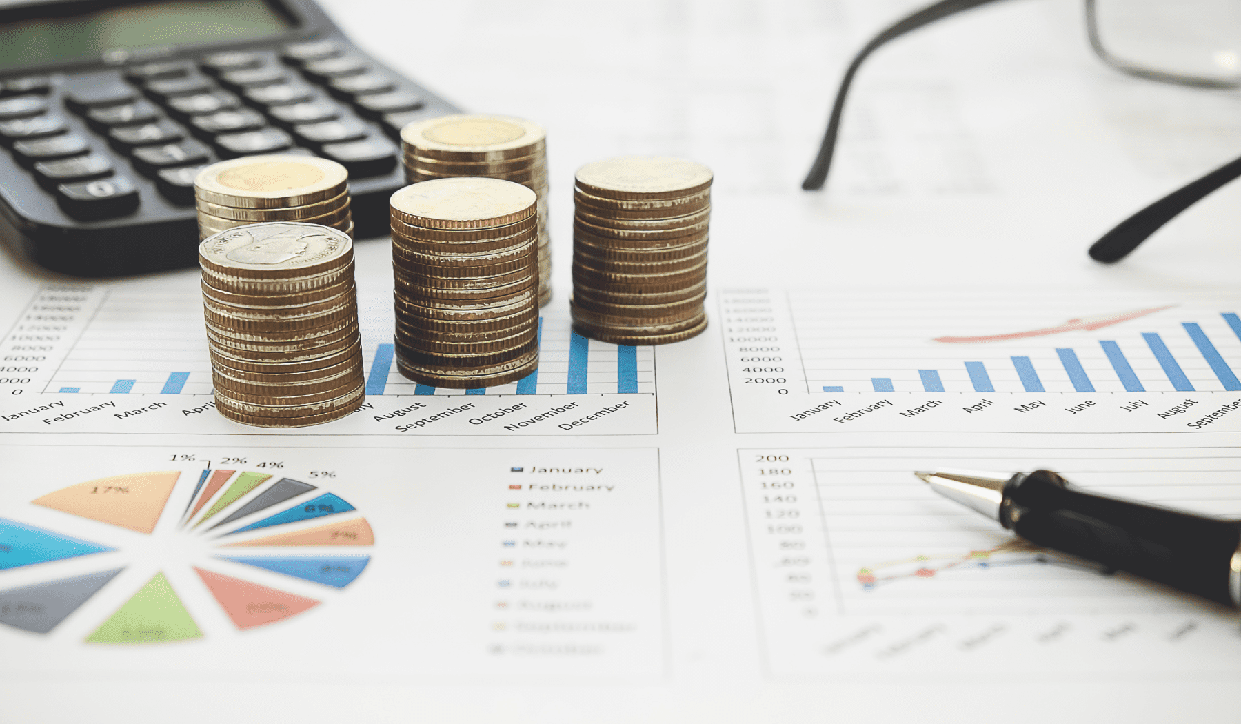 coins stacked on financial documents